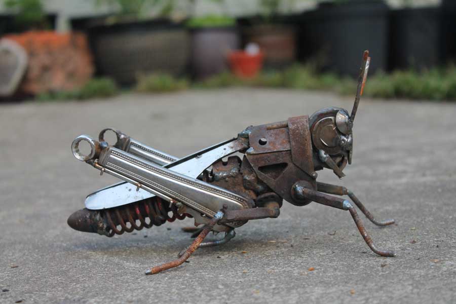 scrap metal sculpture grasshopper by jk brown