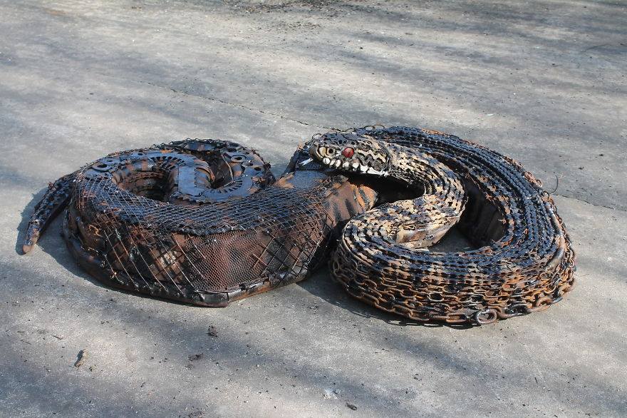 scrap metal sculpture python by jk brown