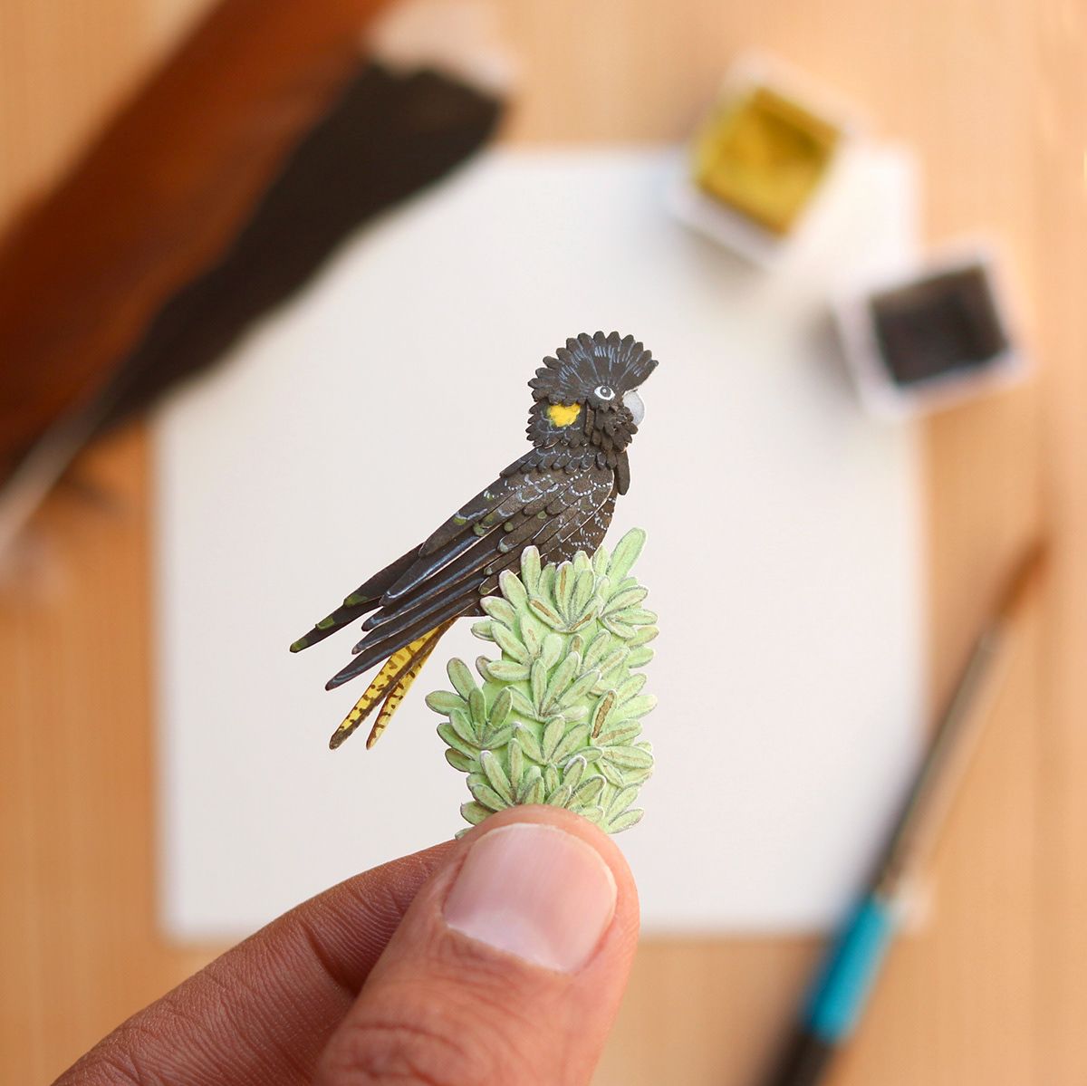 beautiful miniature paper art black cuckoo by nayan vaishali