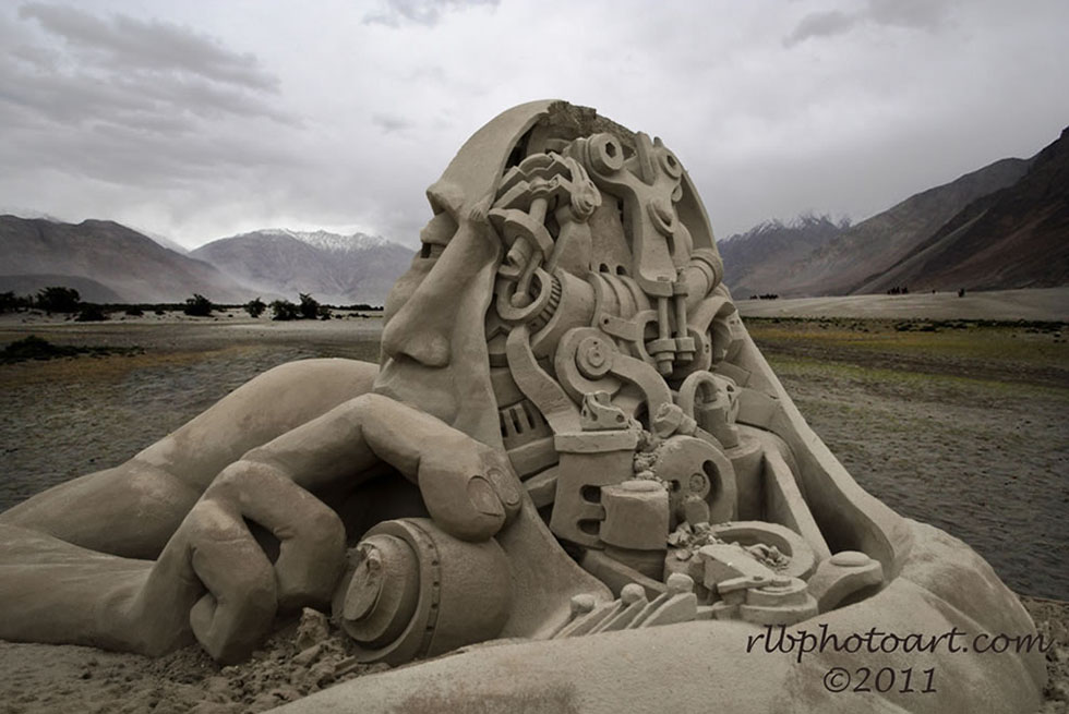 man sand sculpture