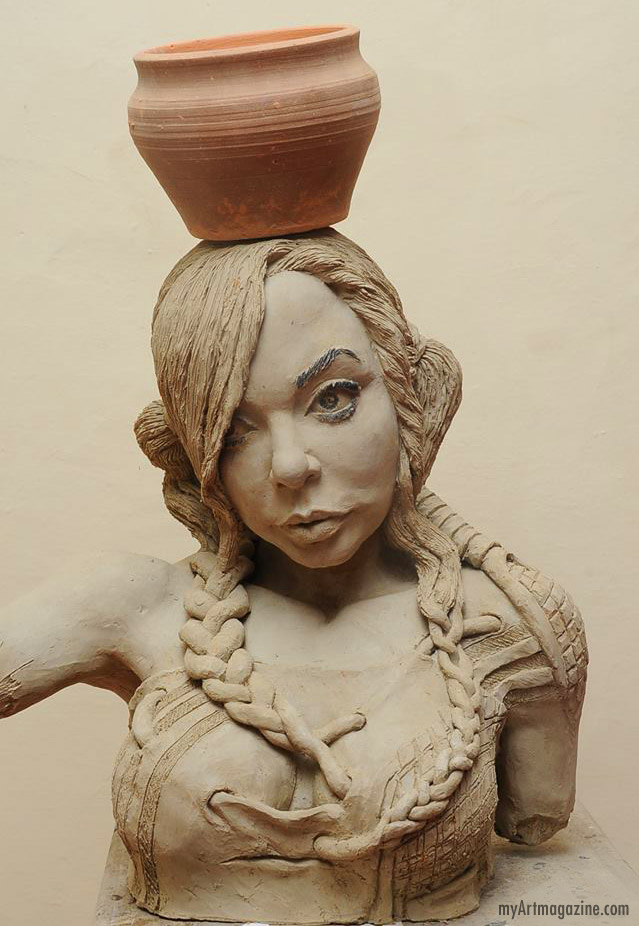 scultpure woman with pot by ghanaian